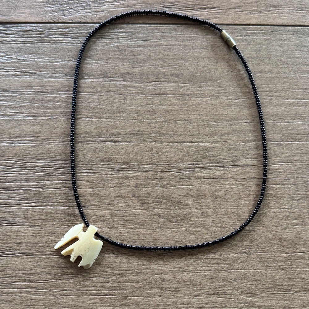 Handcrafted Vintage Black Bead Necklace with Ivory Elephant Pendant